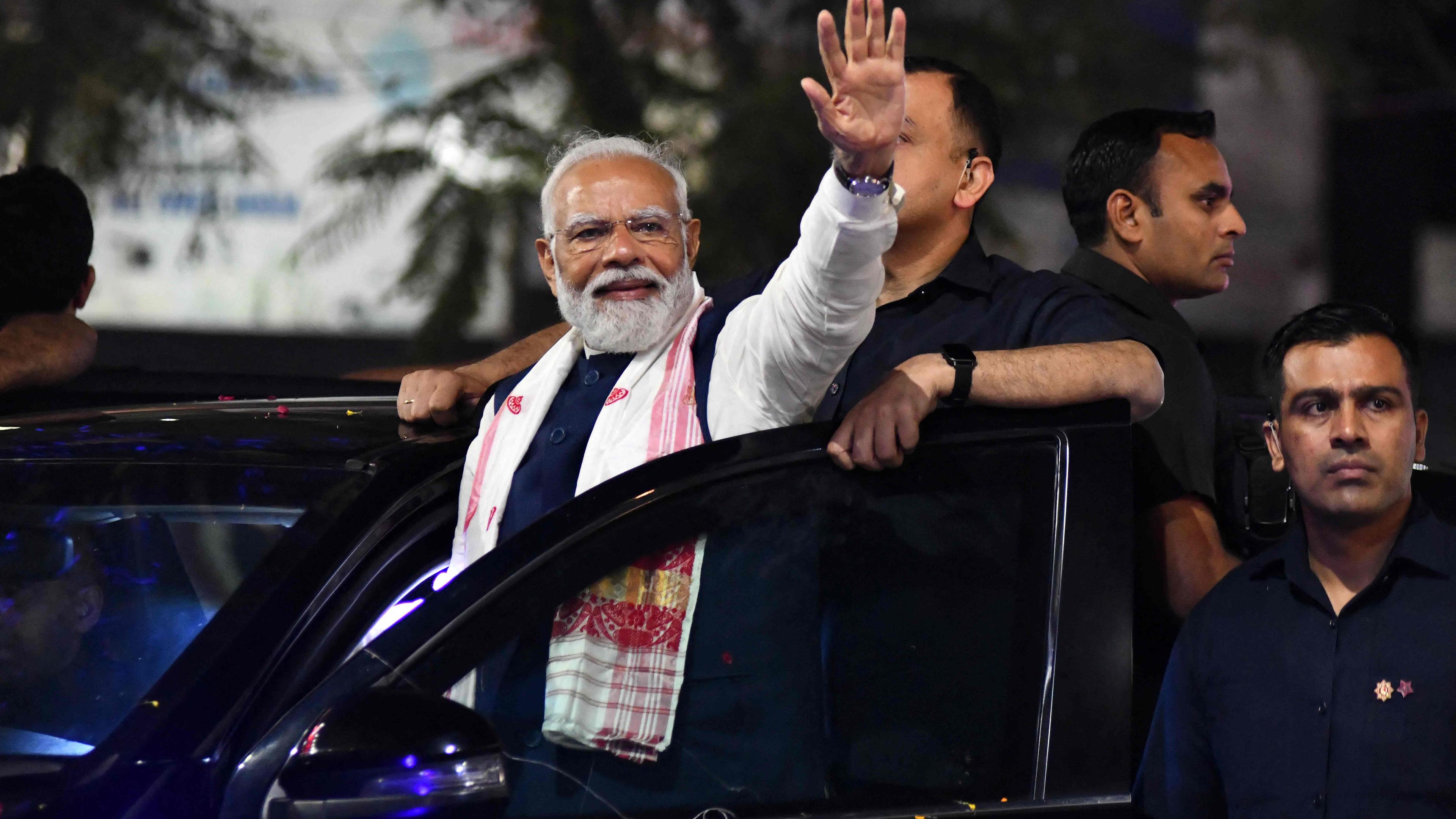 Indian prime minister and leader of the Bharatiya Janata Party (BJP) Narendra Modi waves to supporters during an campaign event on 16 April. Polls in the world’s biggest election open for six weeks from Thursday