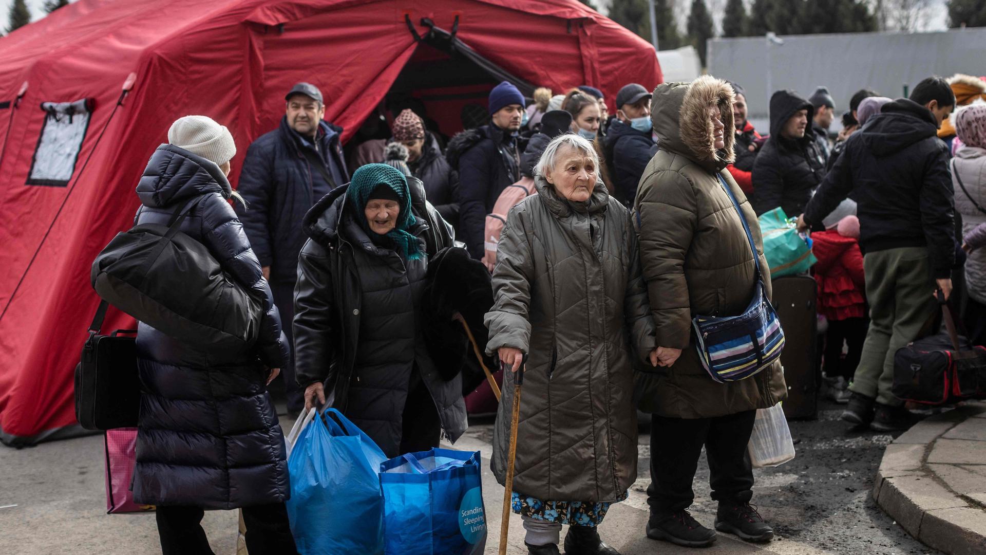 Refugees from Ukraine are seen as they arrive at the border crossing in Korczowa, Poland, March 2, 2022. -