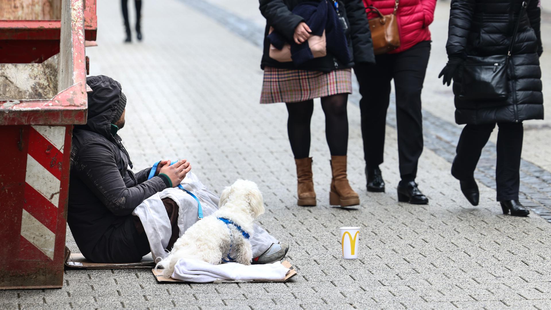 A beggar in a street in Luxembourg City