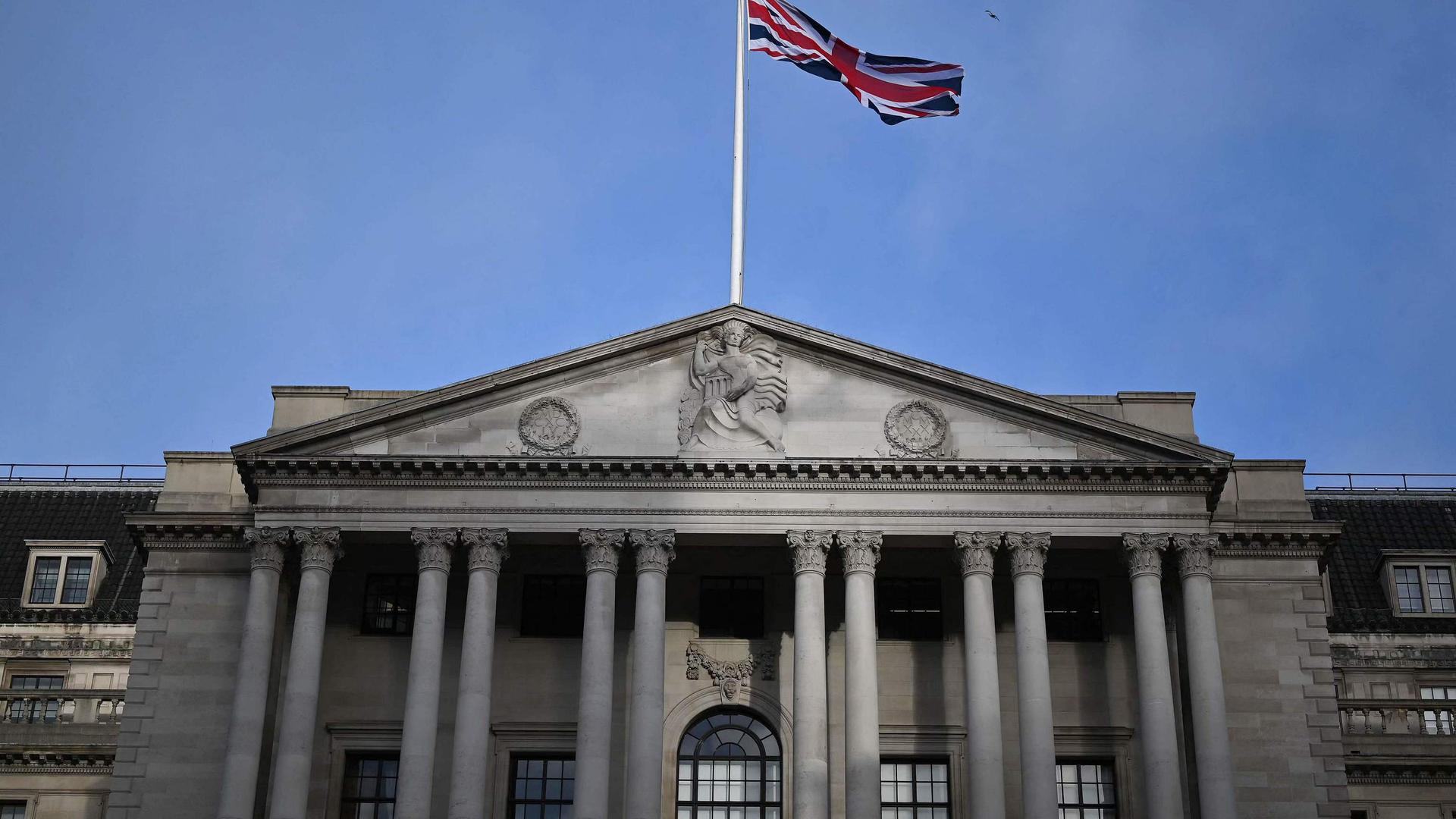 A Union flag flies above the Bank of England, Britain's central bank, in the City of London