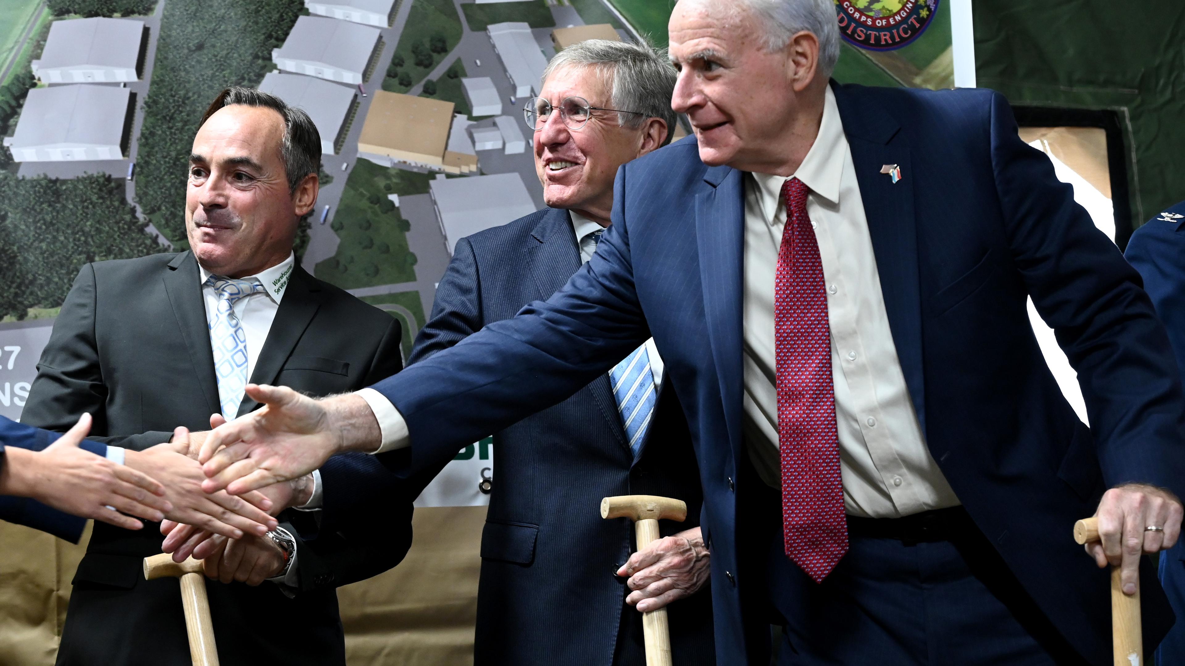 US Ambassador to Luxembourg Tom Barrett (right) extends his hand as Defence Minister Francois Bausch (second from right) and Warehouse Service Agency Director Laurent Bodson look on during a ground-breaking ceremony on Thursday