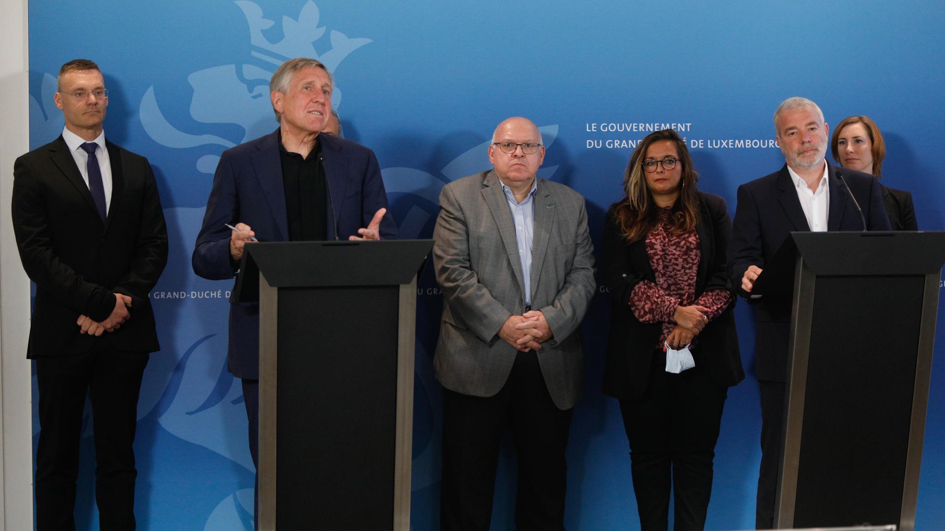 Luxair CEO Gilles Feith (left) and Transport Minister François Bausch (second from left) speak as a news conference on Tuesday about the airline shedding more jobs also attended by labour union leaders and Labour Minister Dan Kersch (second from right)
