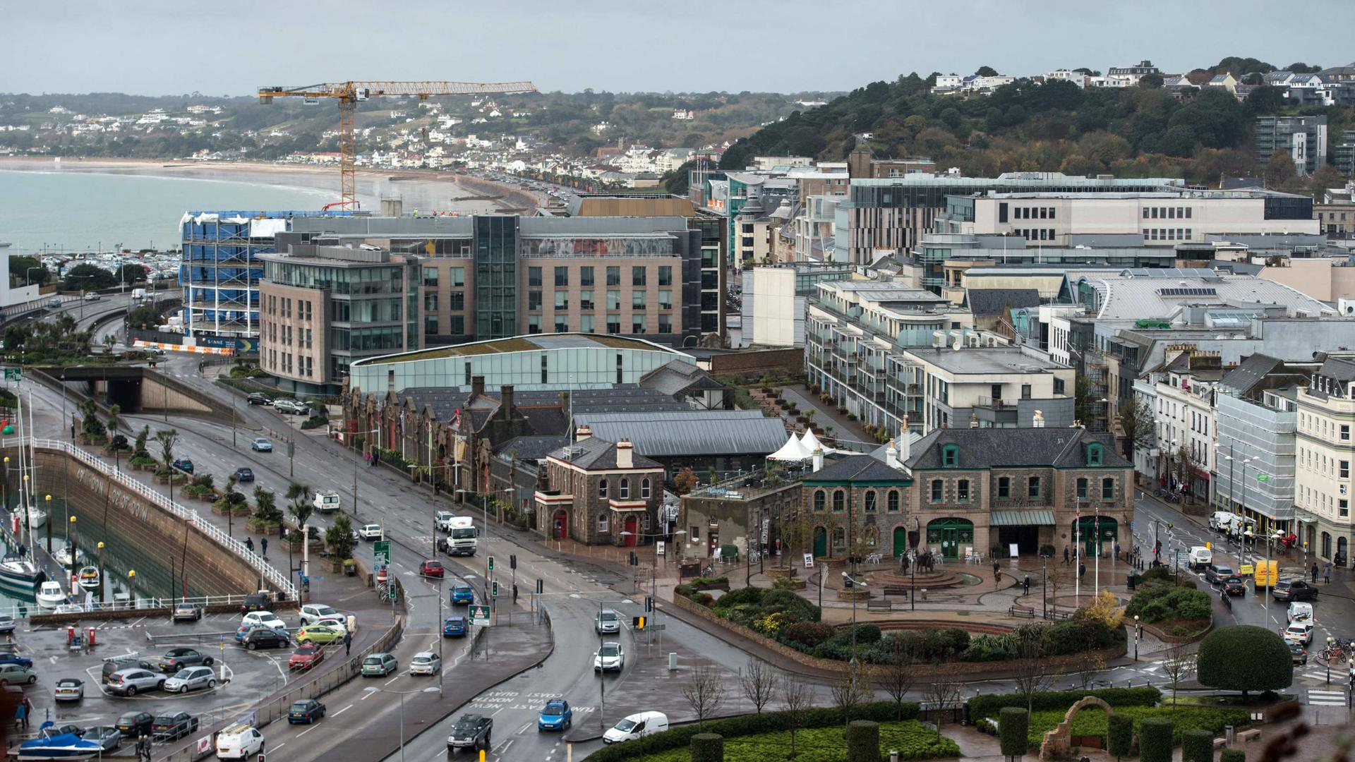 Office and residential buildings are pictured in front of the beach and seafront in St Helier, on the British island of Jersey