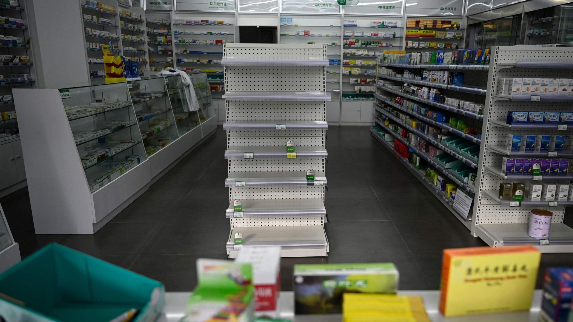 An empty shelf of medicine is seen at a pharmacy amid the Covid-19 pandemic in Beijing on 17 December 2022