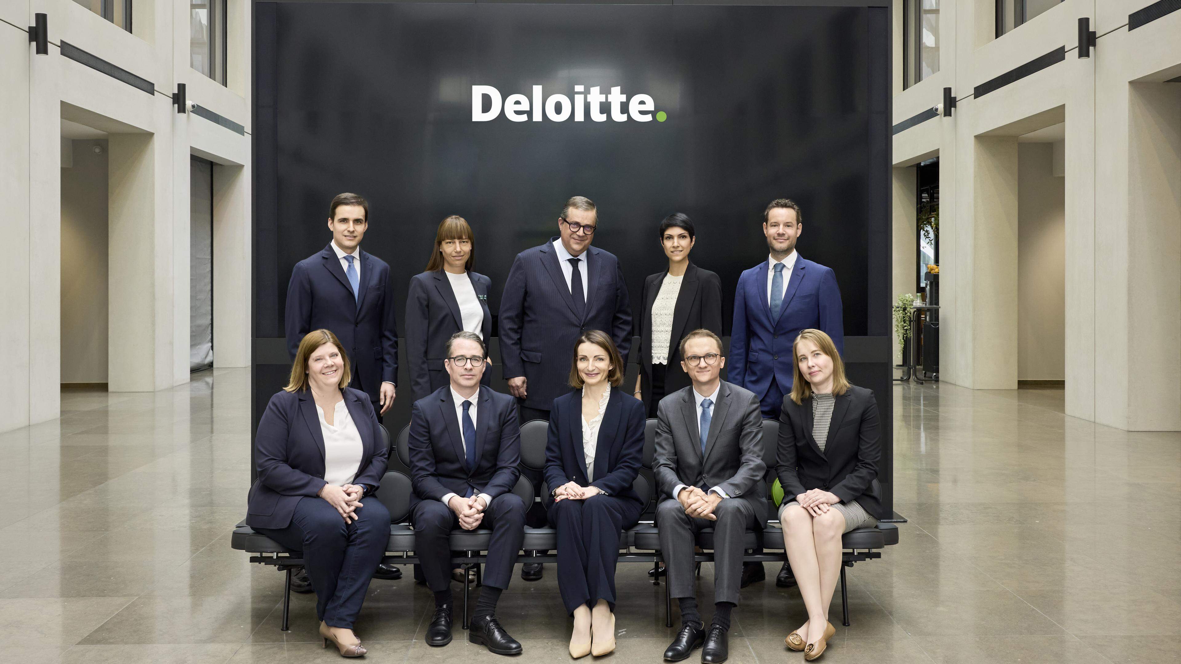 Nine of the new appointees pose with Deloitte Luxembourg CEO and Managing Partner John Psaila (centre, top row)