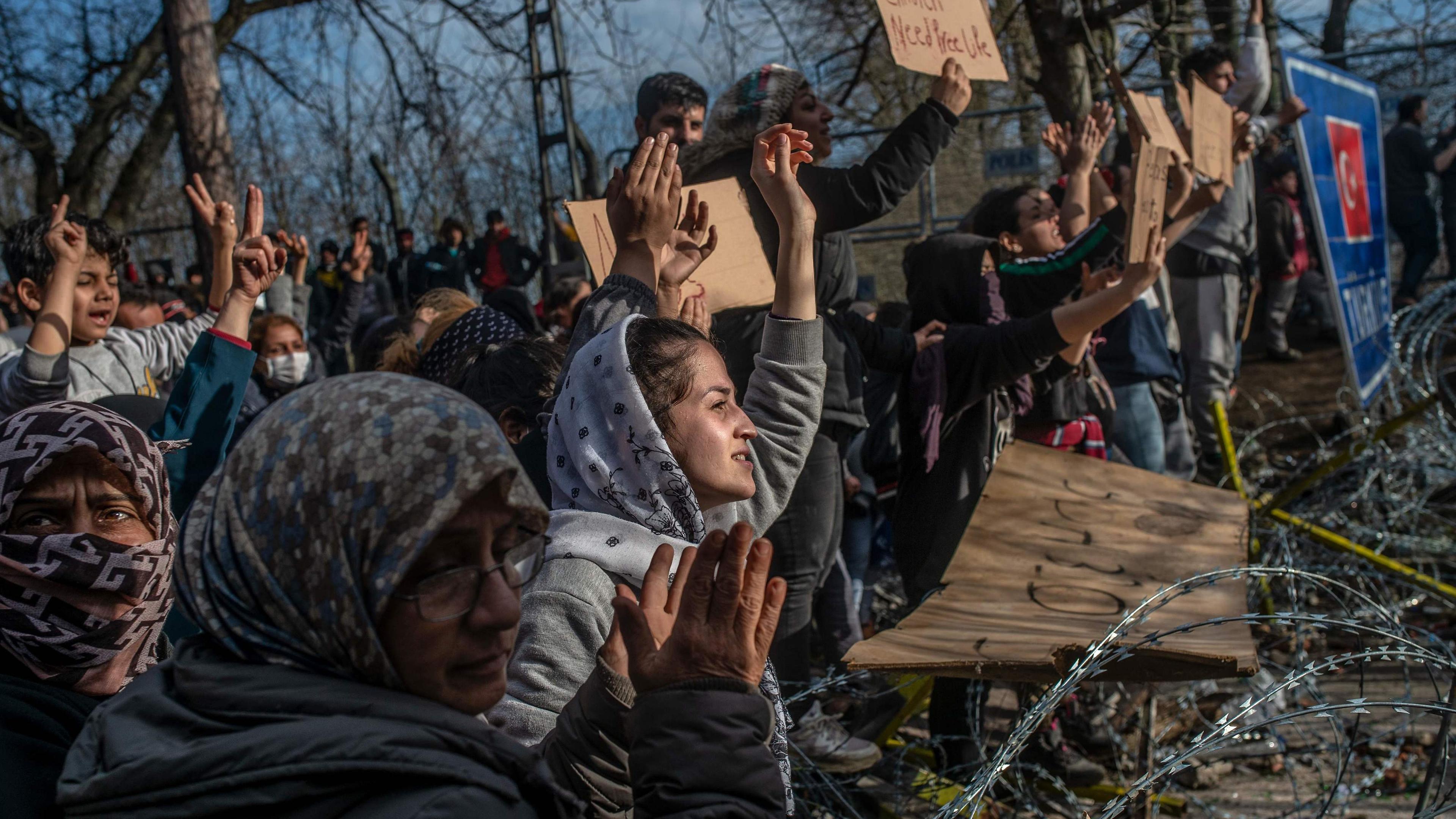 Refugees waiting at a buffer zone in front of the Pazarkule border crossing between Turkey and Greece 