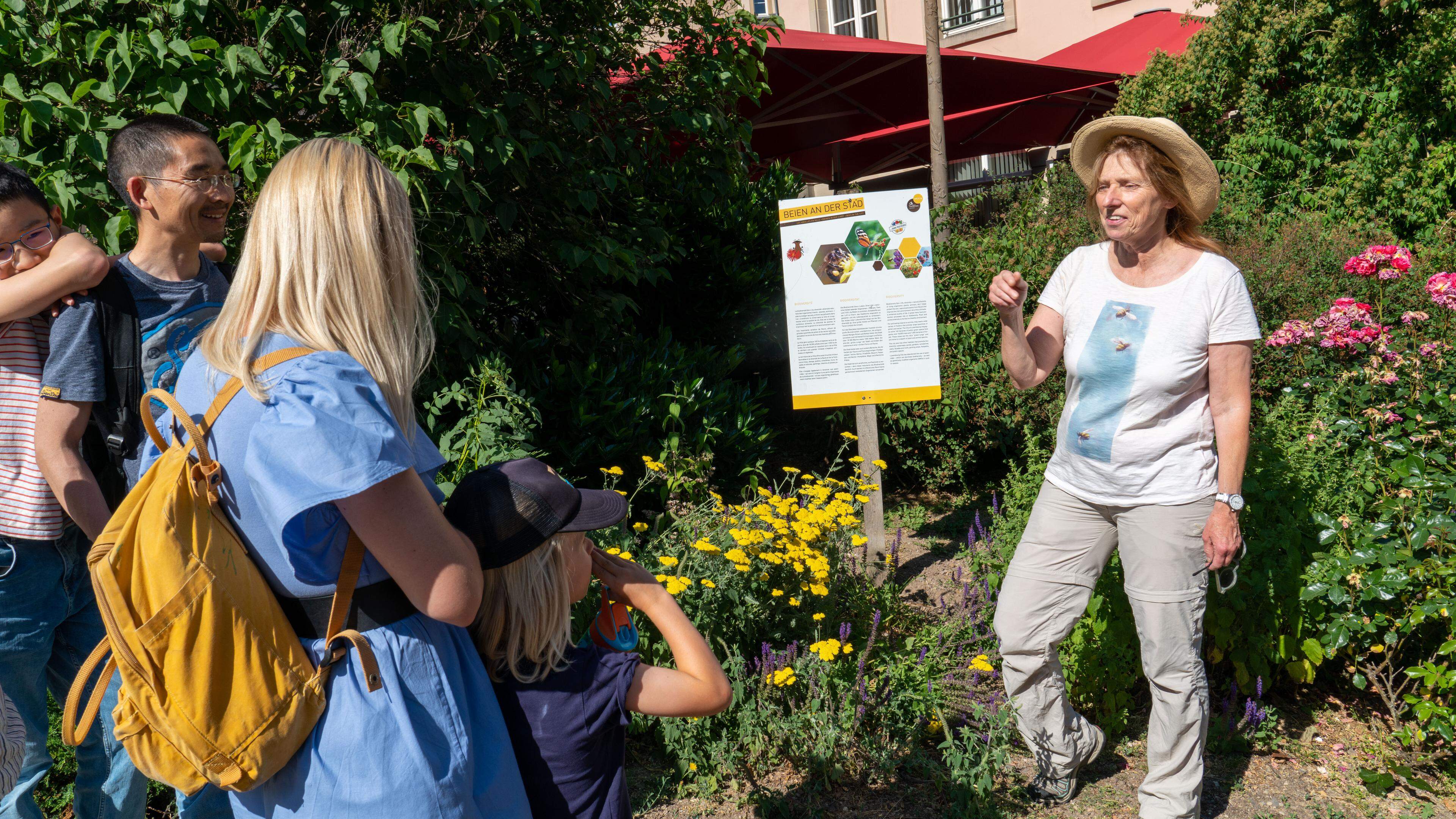 Bee specialist Muriel Nossam leading a tour in English of the city's Bee Trail 