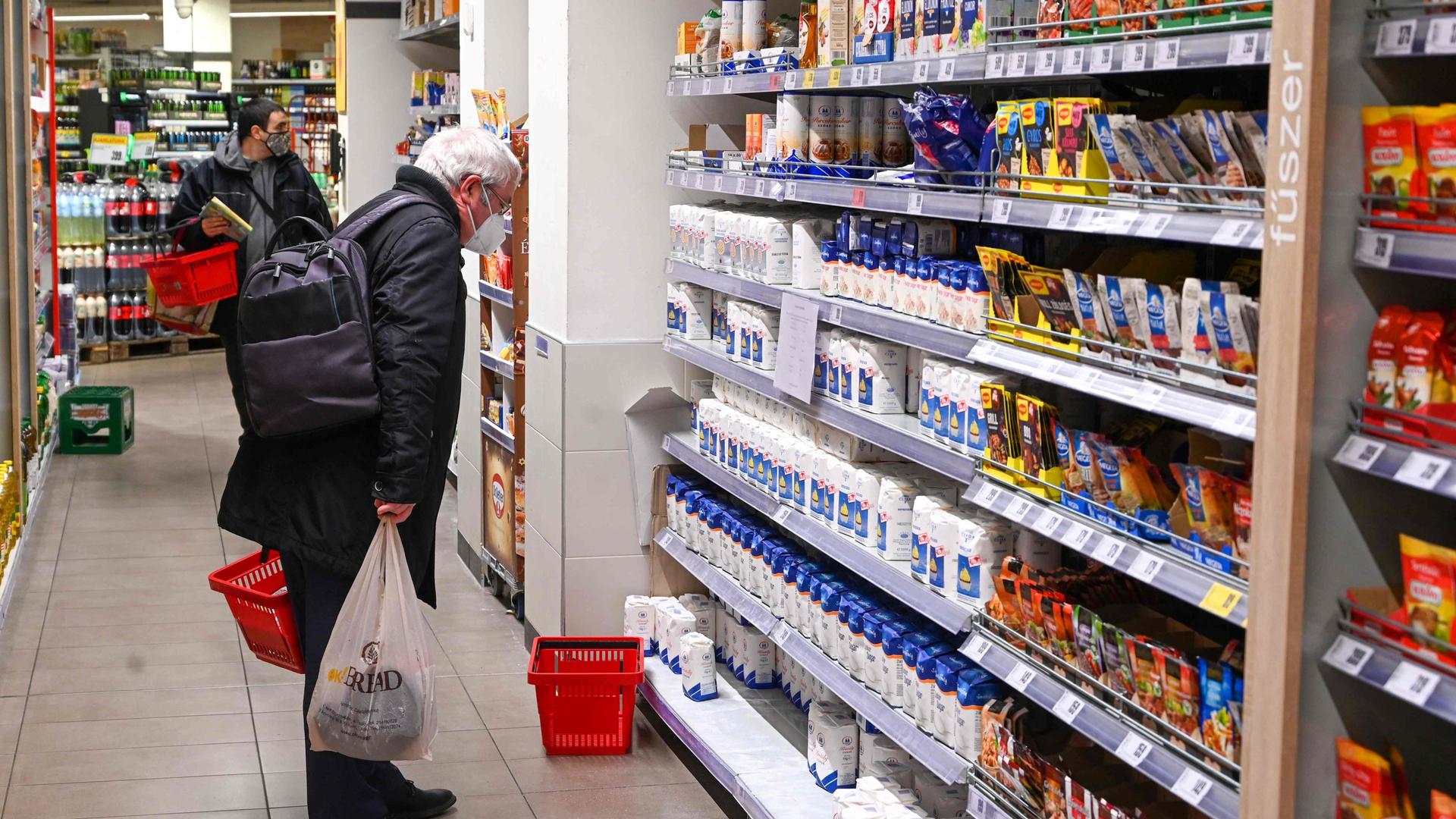 A customer shopping in a supermarket in the Hungarian capital, Budapest, on February 1 