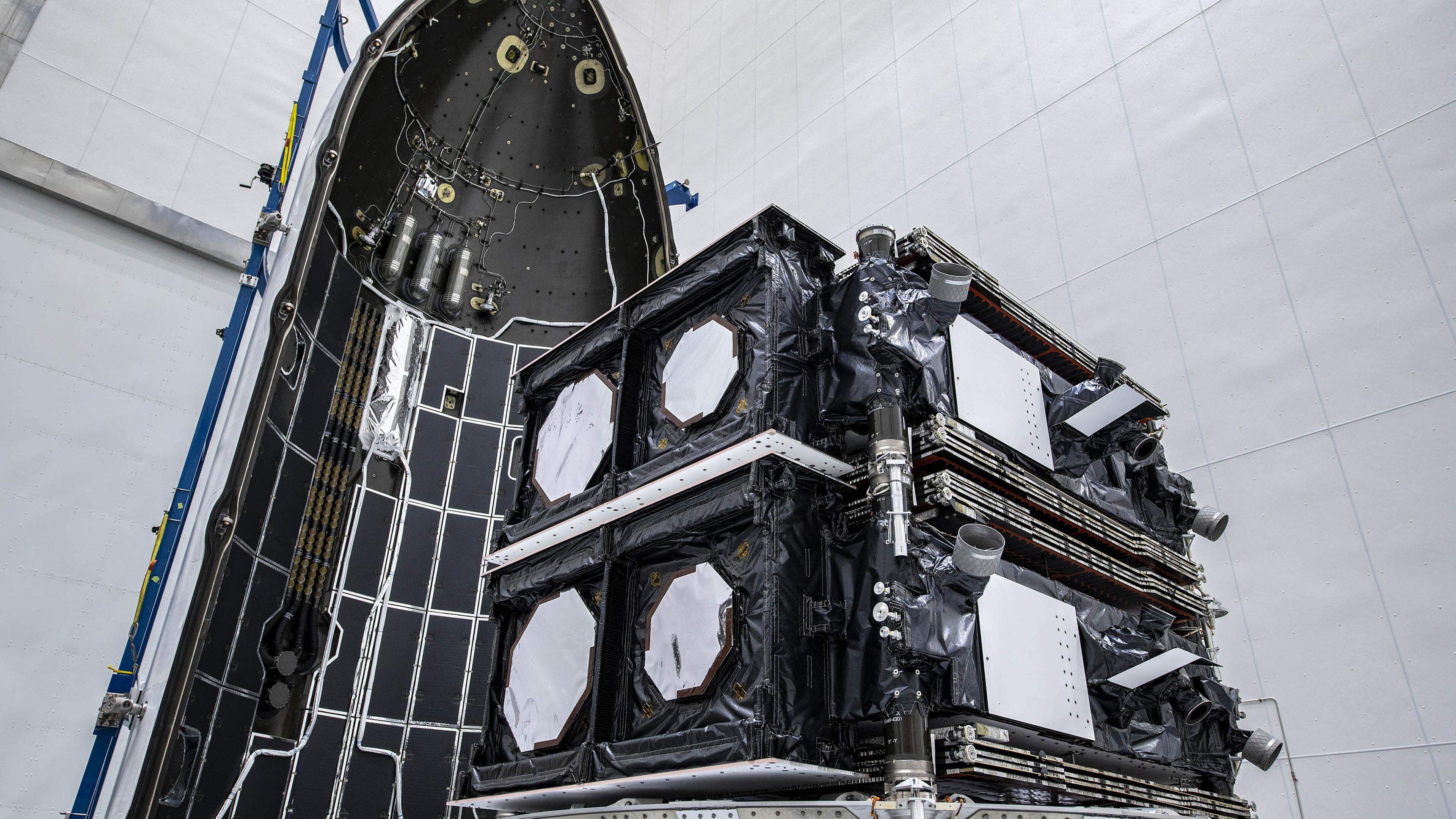 Two O3b mPOWER satellites are packed in a capsule in April 2023 before their blastoff 
