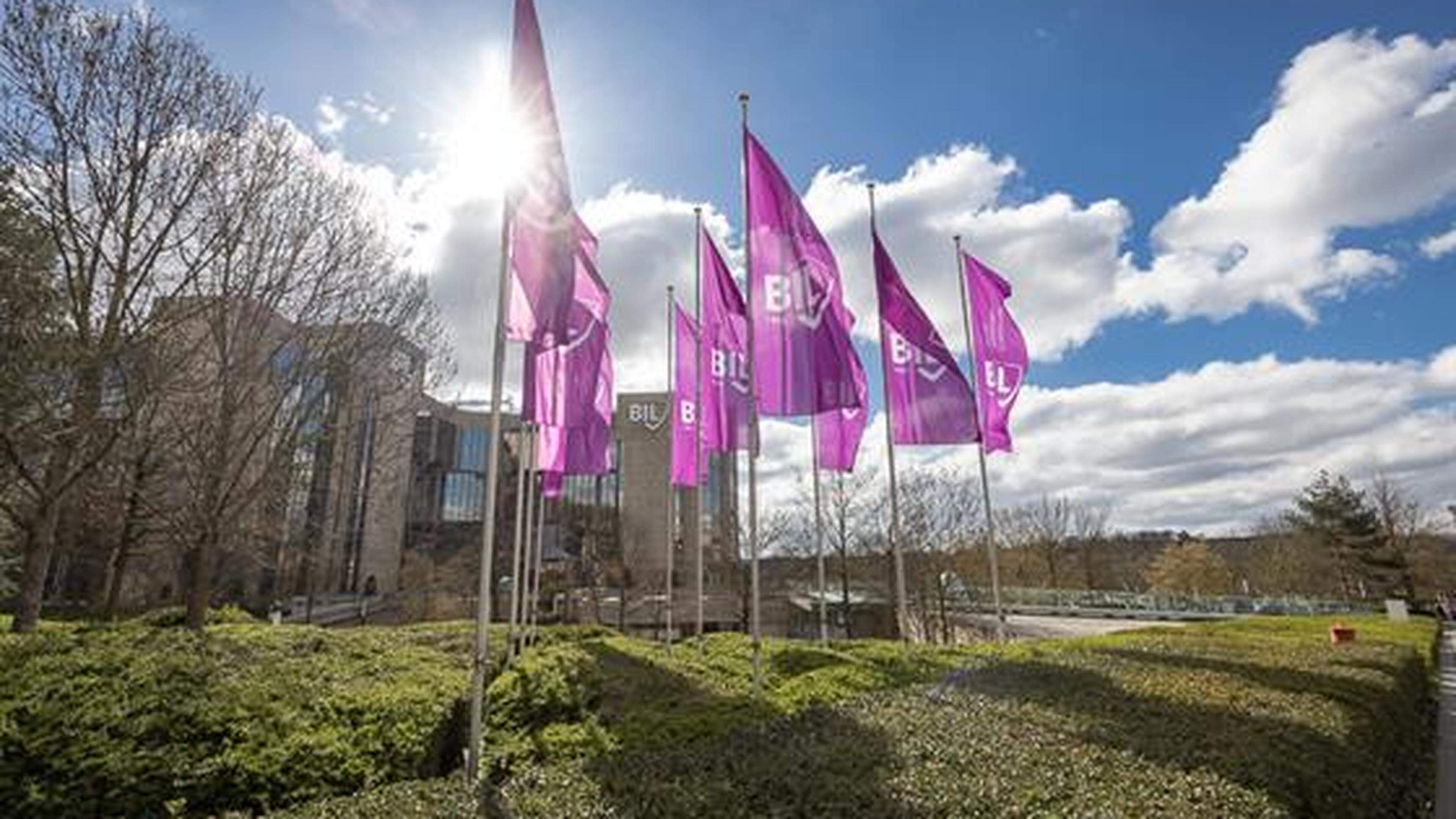 Flags flutter on the grounds outside Banque Internationale à Luxembourg headquarters