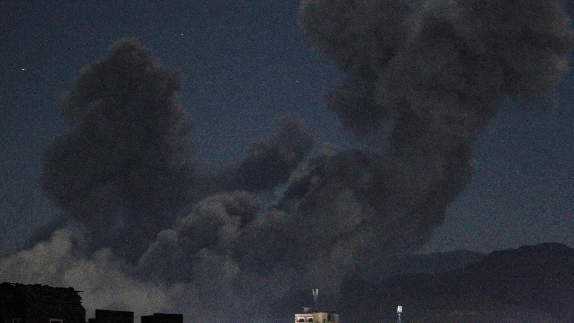 A plume of smoke billows during a US strike on Yemen's Huthi-held capital Sanaa early on 16 March 16.