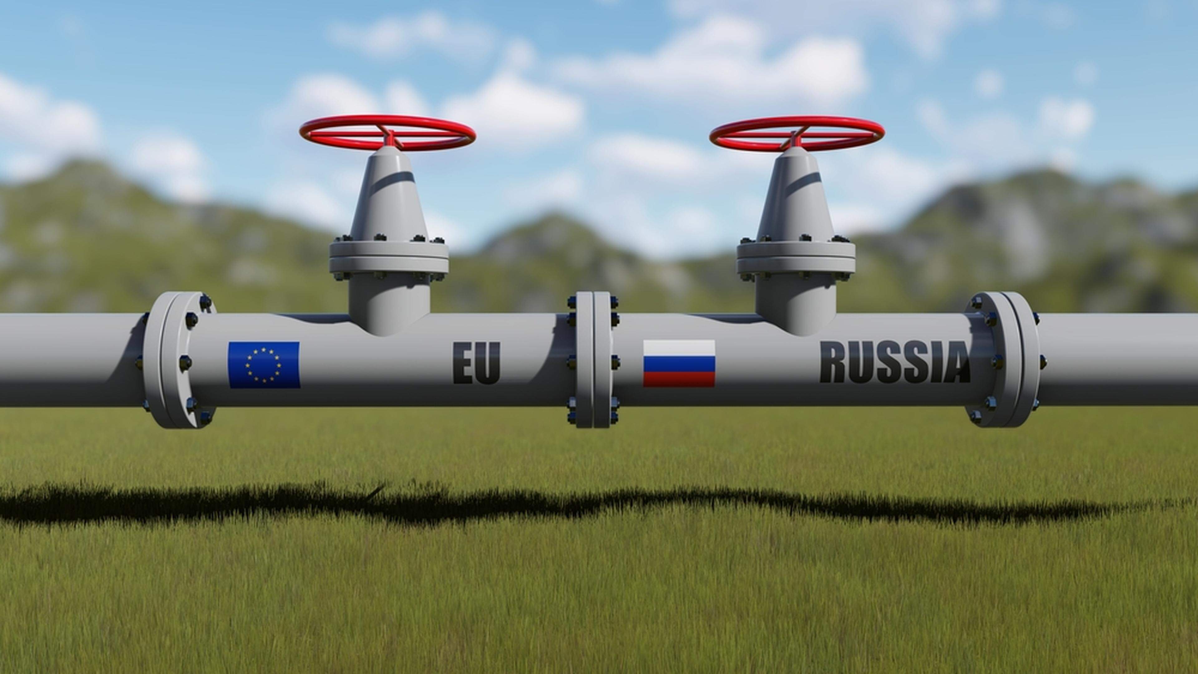 A gas pipeline with flags of Russia and the EU